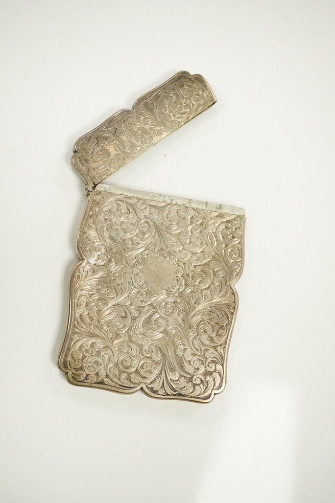 A Victorian silver card case engraved with a heron, maker Nathaniel Mills, Birmingham 1843, in original leather case, another Nathaniel Mills case with foliate scroll engraving, Birmingham 1840, and a silver mounted leat